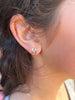 Diamond Bezel J Huggie Earrings